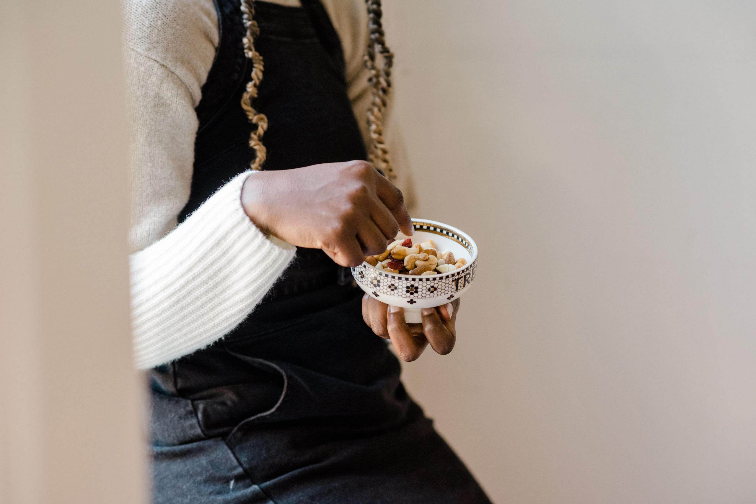 A person eating trial mix snacks